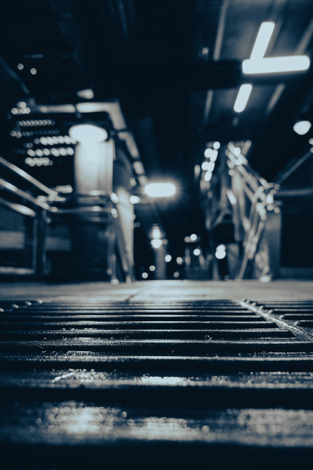 a black and white photo of a subway platform