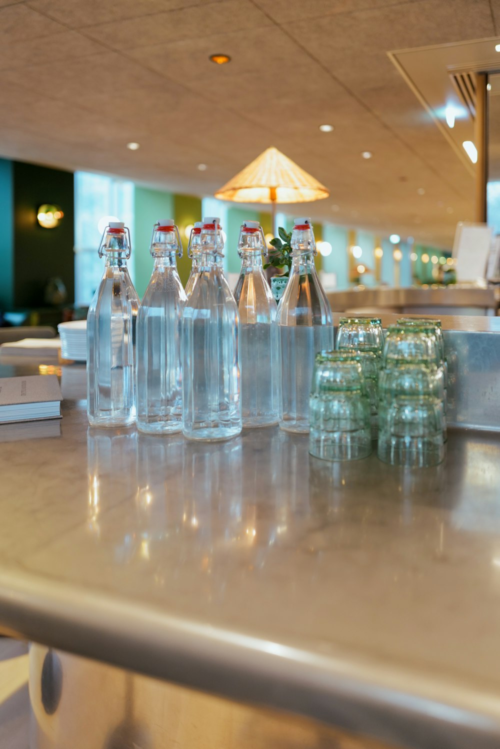 a group of bottles of water sitting on top of a counter