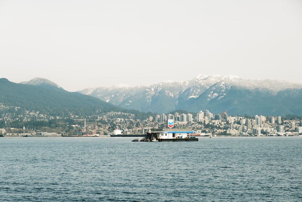 a large body of water with a city in the background