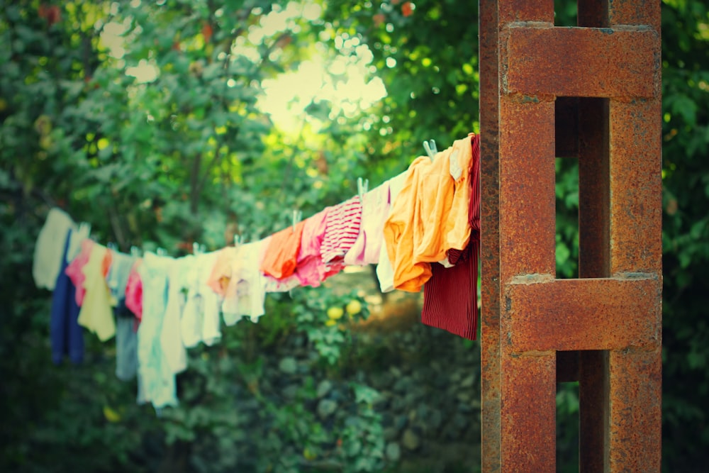 a bunch of clothes hanging on a clothes line