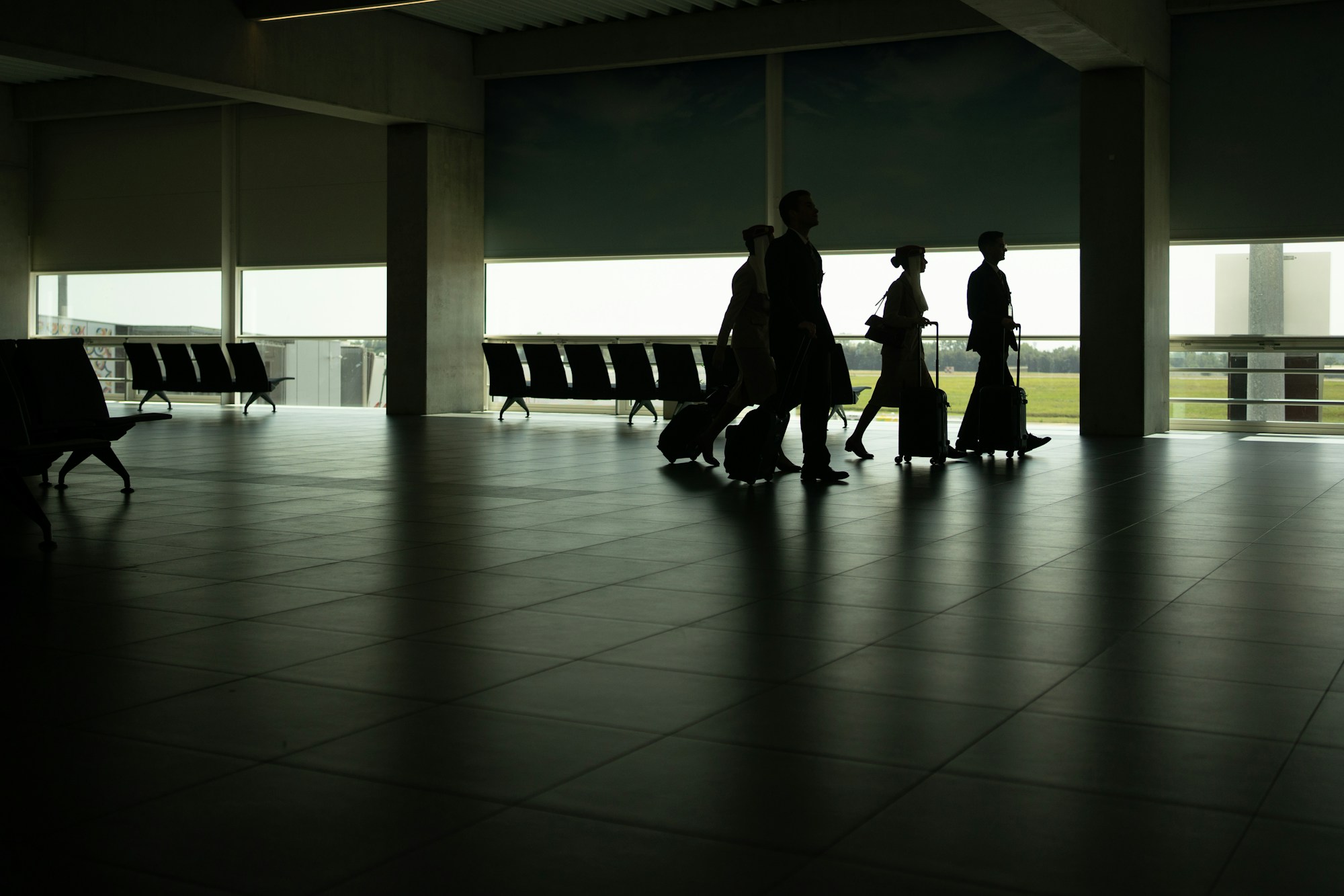 People walking through an airport terminal