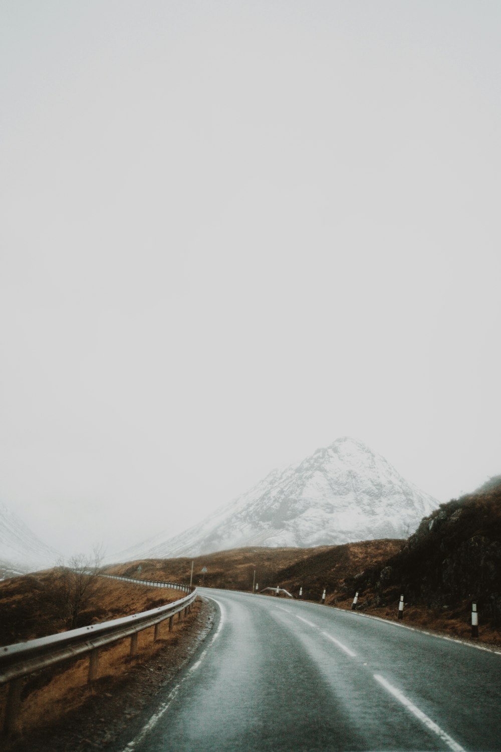 a road with a mountain in the background