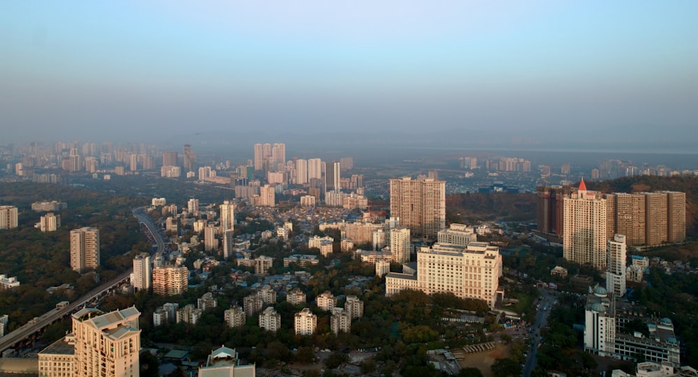 an aerial view of a city with tall buildings