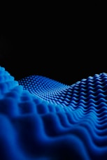 a black background with a blue wave pattern