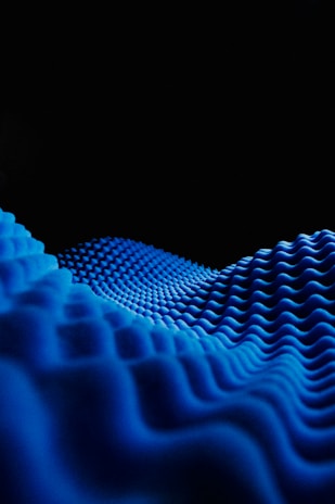 a black background with a blue wave pattern