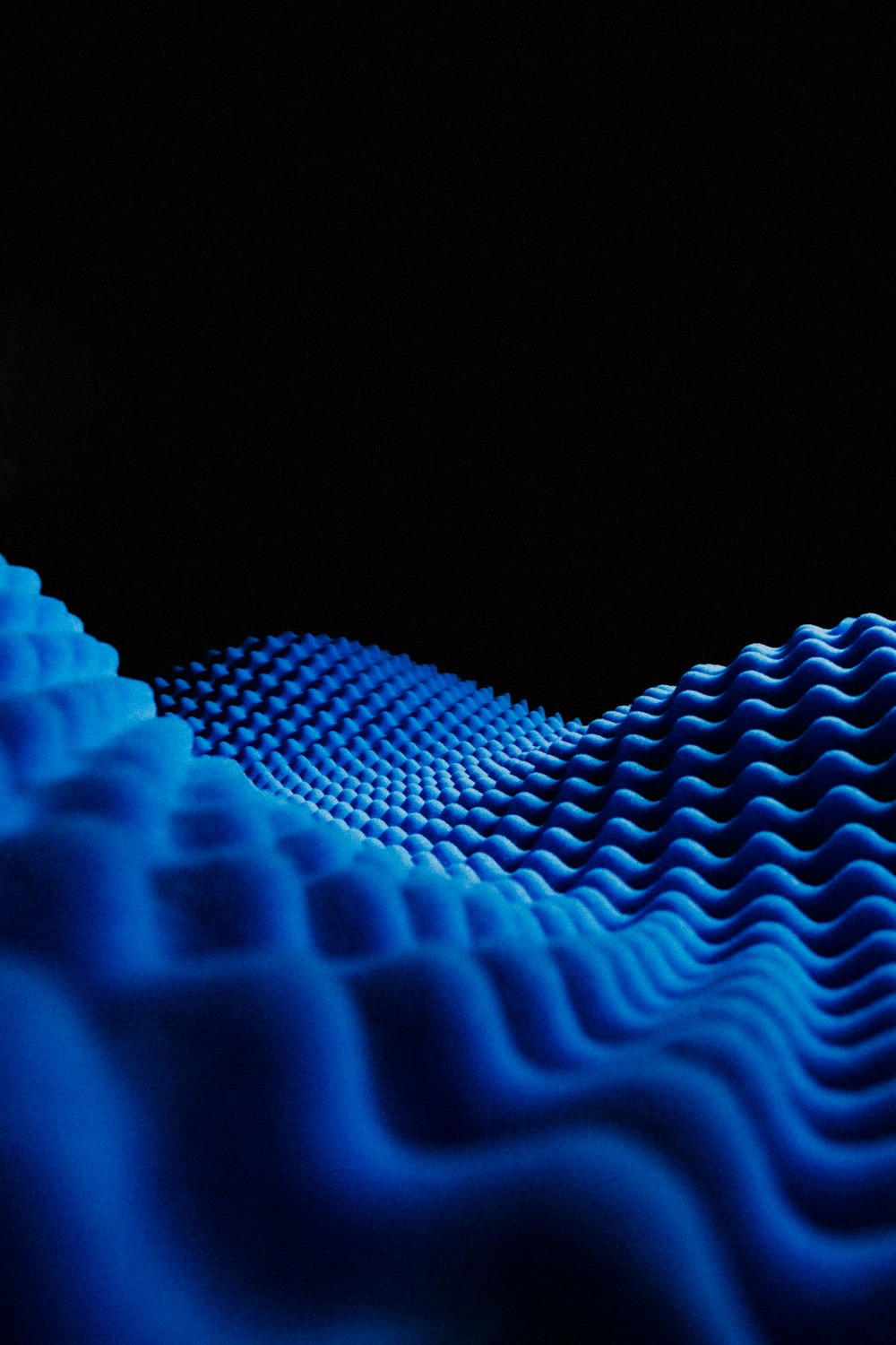 a black background with a blue wave pattern