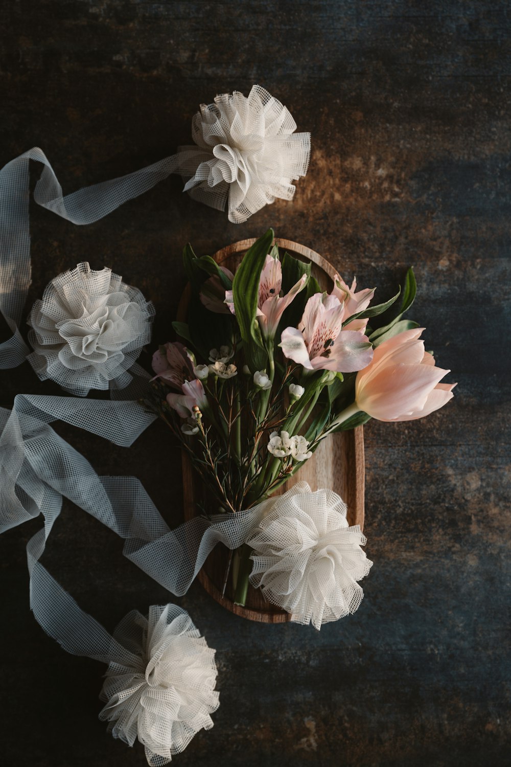 a bunch of flowers sitting on top of a table