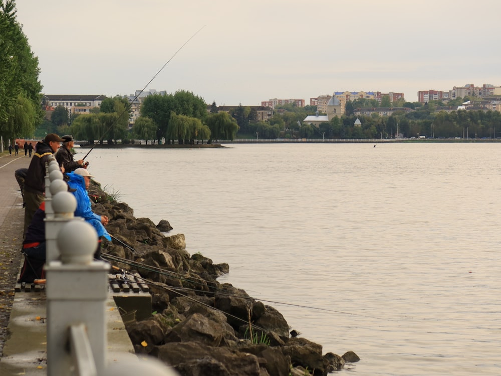 a group of people fishing on a lake