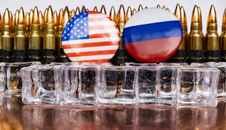 a bunch of bullet casings with flags on them