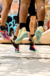 a couple of people that are standing on a skateboard