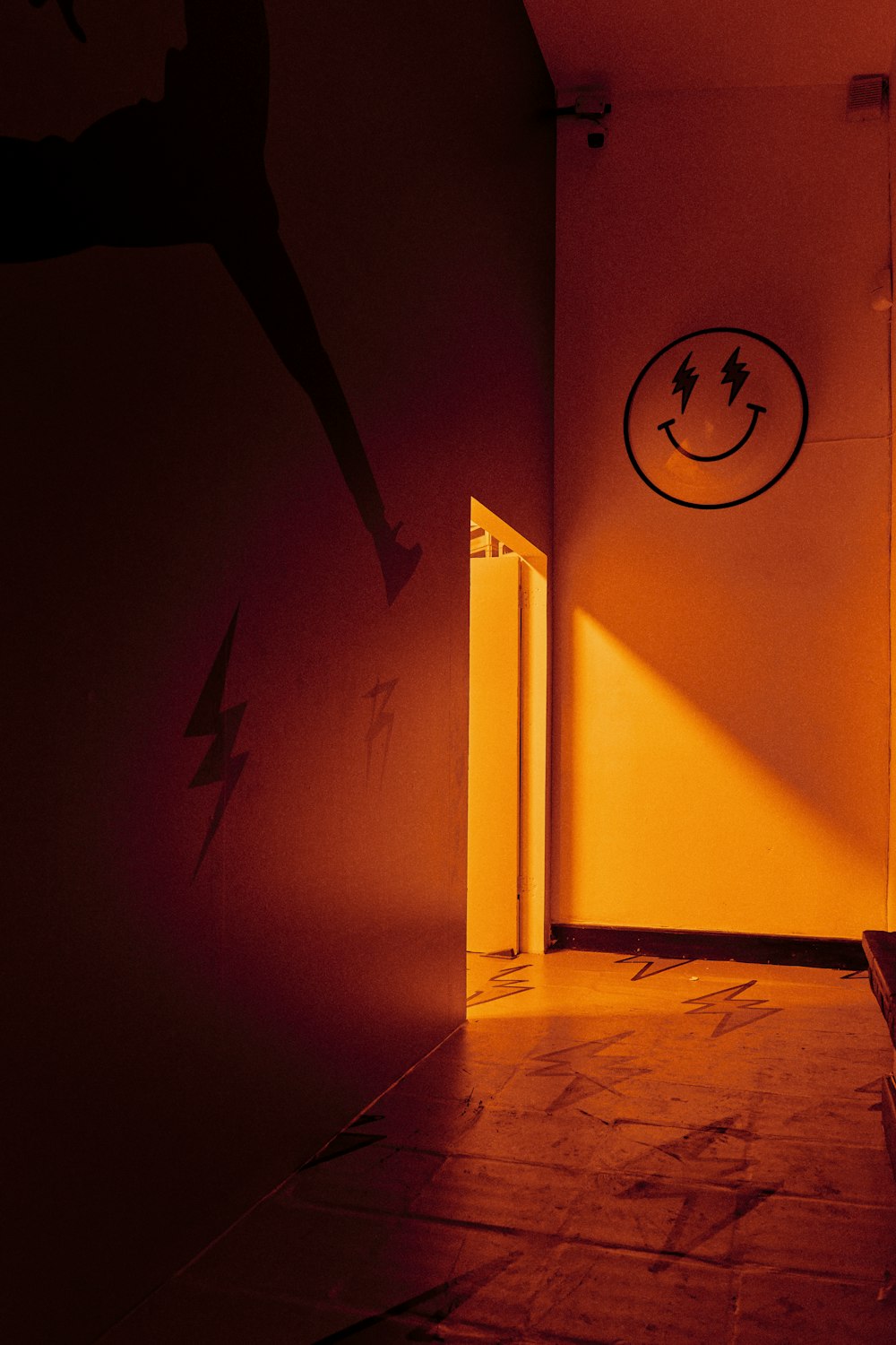 a hallway with a smiley face painted on the wall