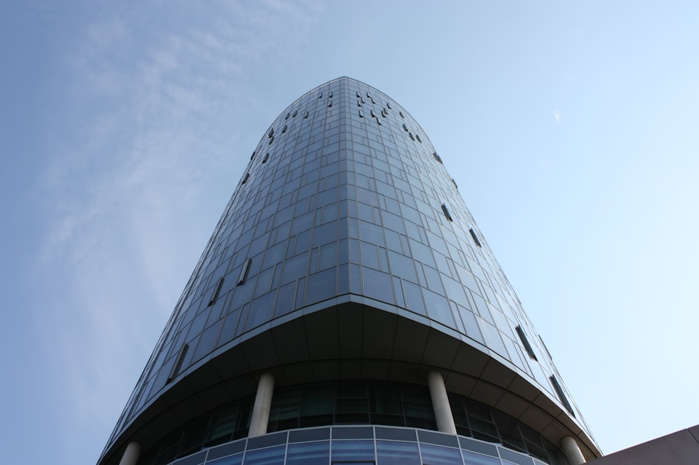 a very tall building with a sky background