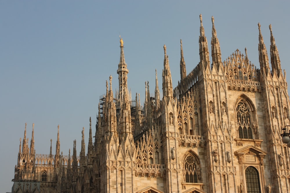 a large cathedral with a clock on the front of it