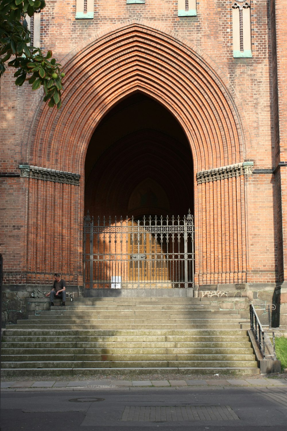 a large brick building with stairs leading up to it