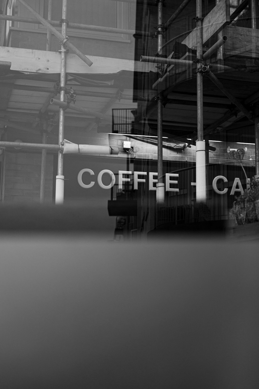 a black and white photo of a coffee shop