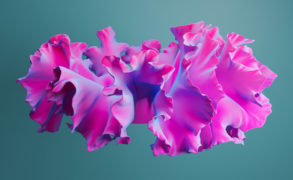 un primo piano di un fiore rosa su uno sfondo blu