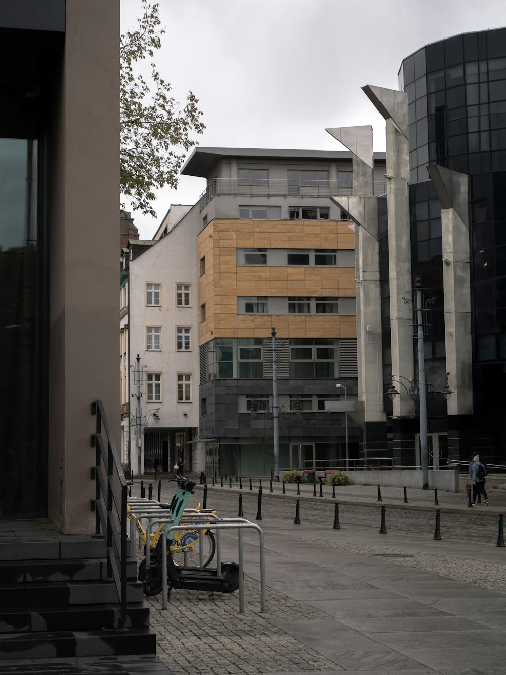 a person sitting on a bench in front of a building