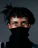 a person with a black scarf covering her face