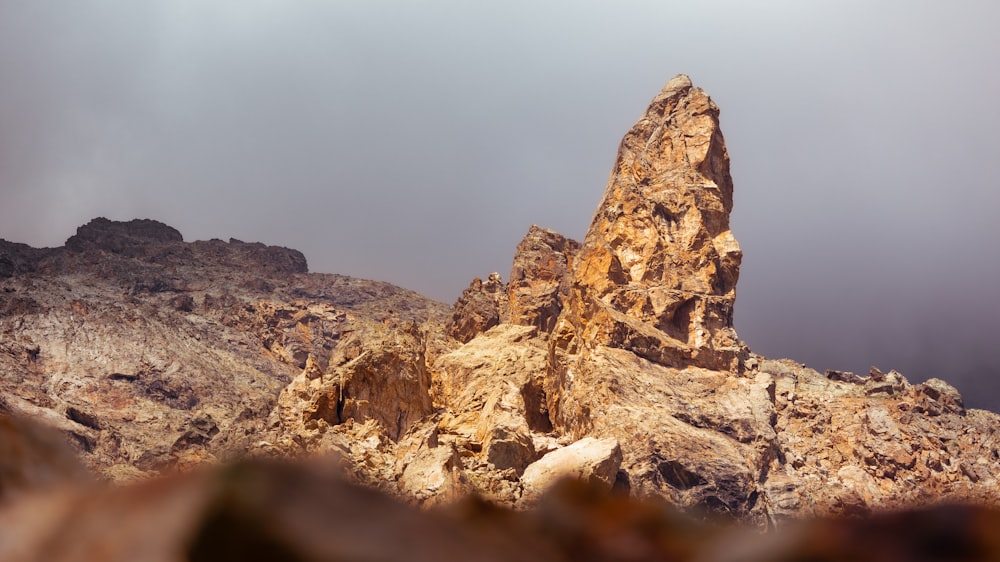 a rock formation in the middle of a mountain range