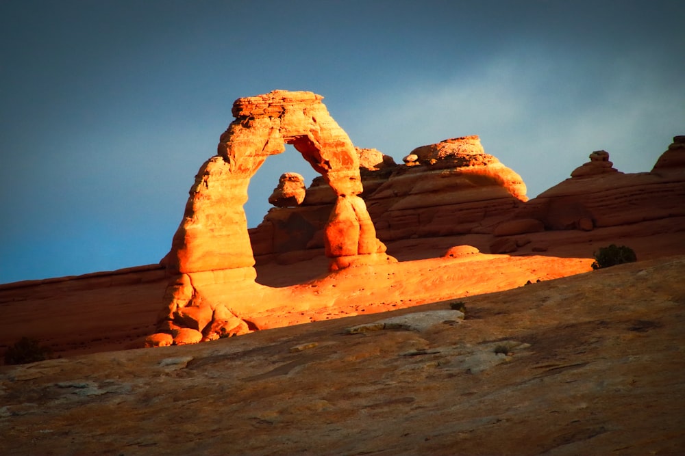 a rock formation in the middle of a desert