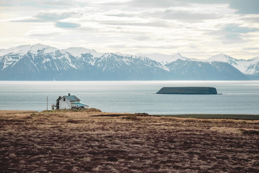 a large body of water with mountains in the background