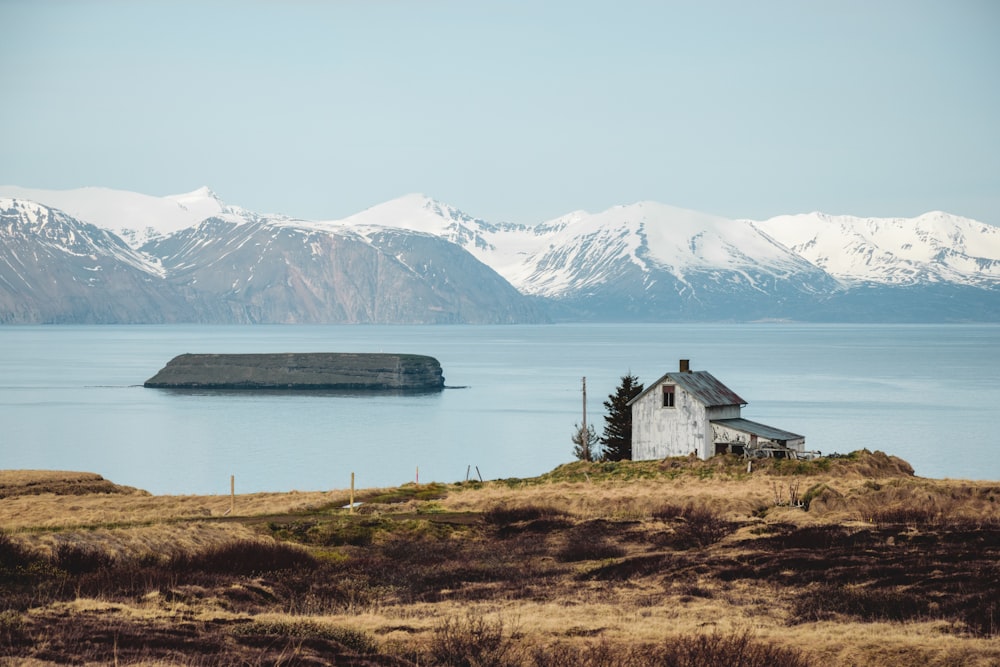 a house on a hill overlooking a body of water