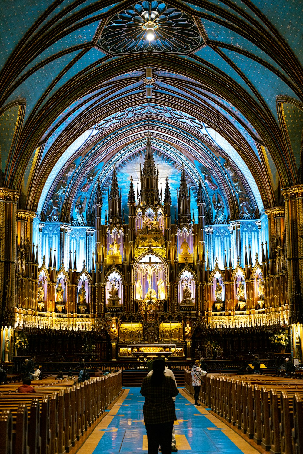 a person standing in front of a large cathedral