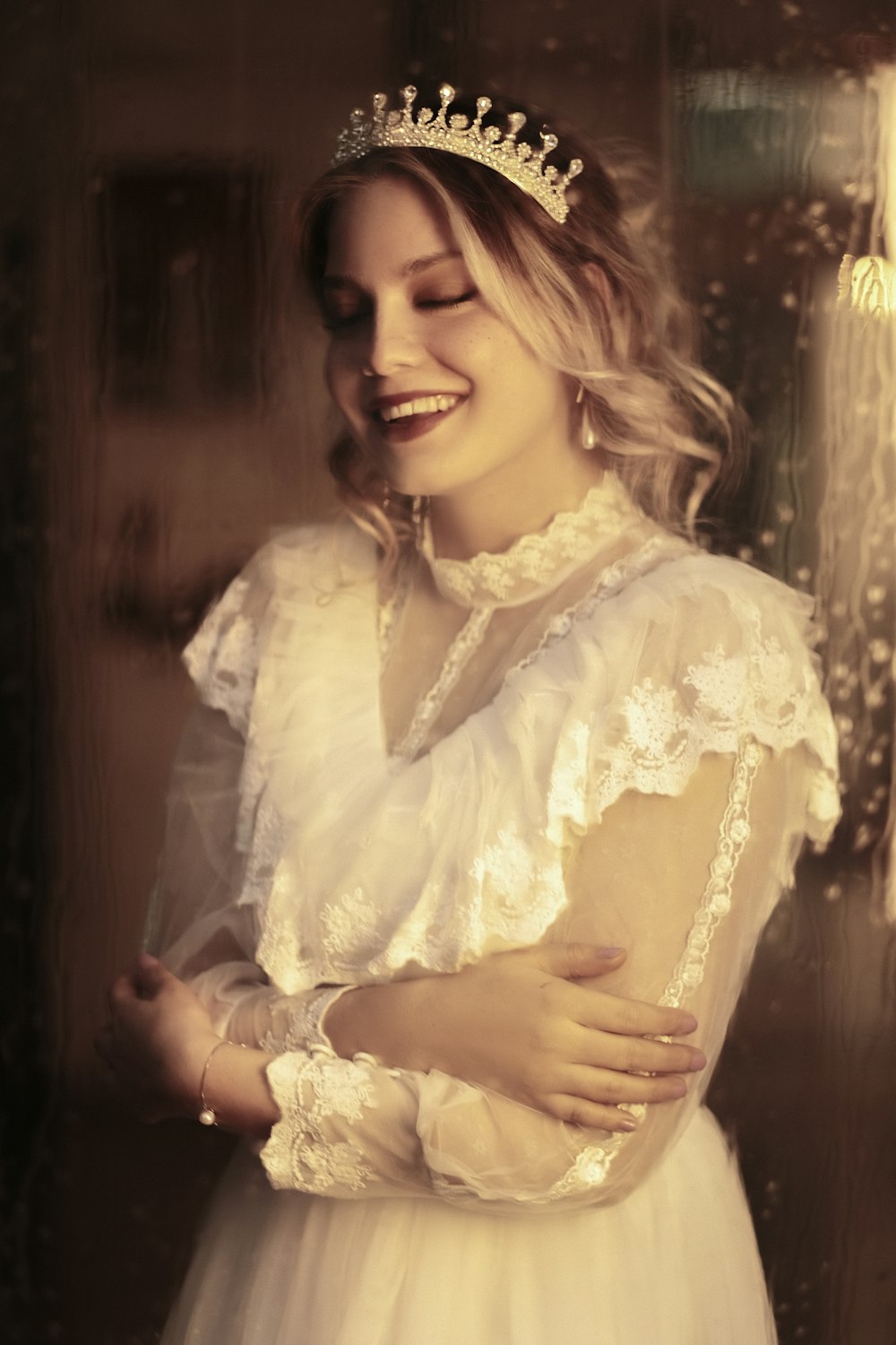 a woman in a white dress and a tiara