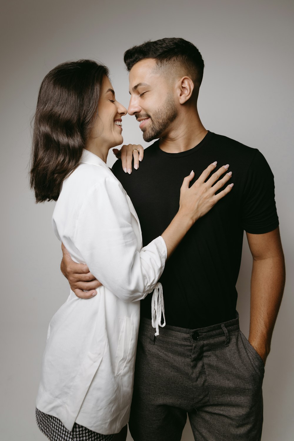 a man and a woman standing next to each other