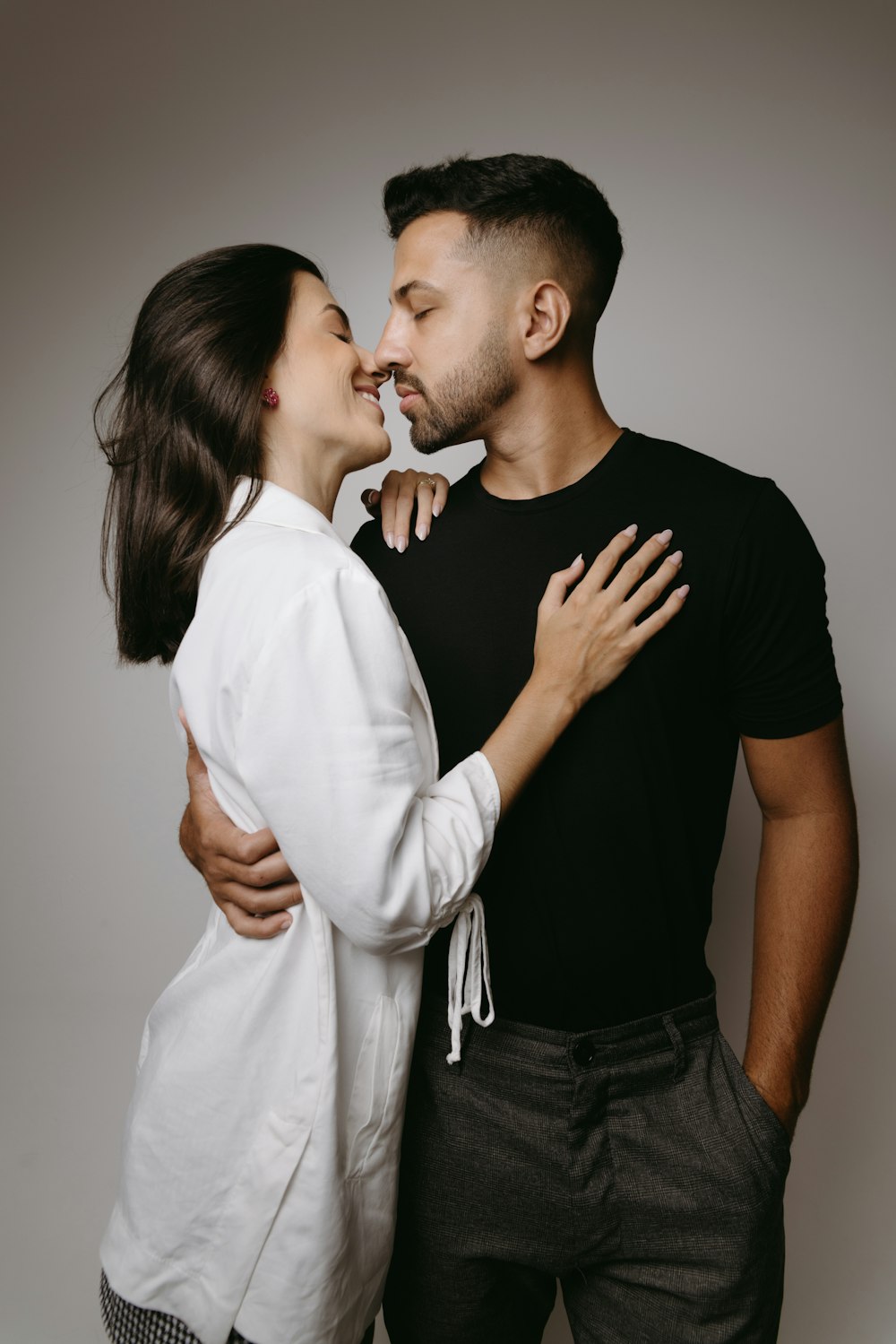 a man and a woman kissing each other