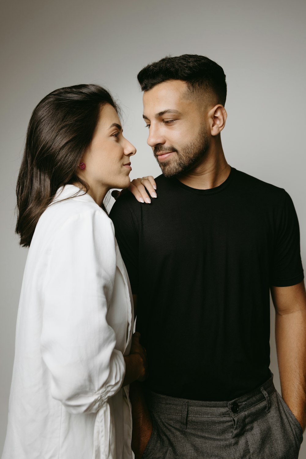 a man and woman standing next to each other