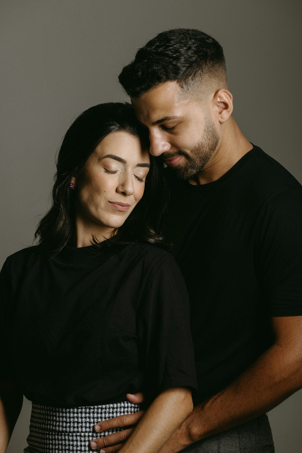 a man and a woman standing next to each other