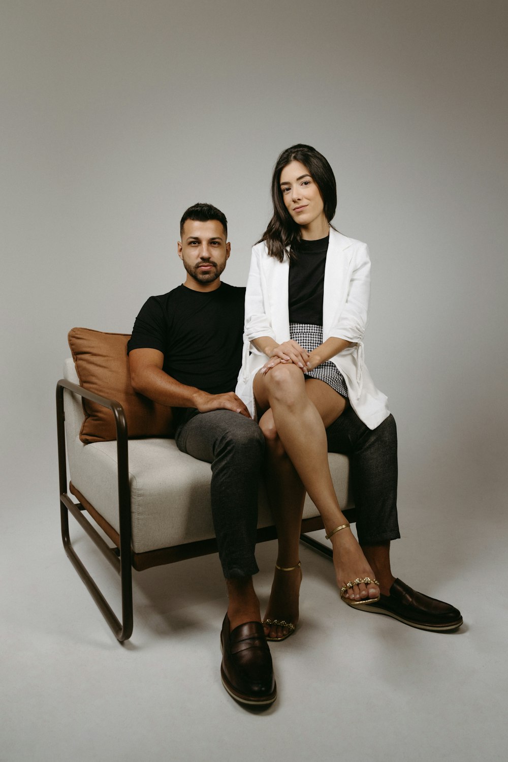 a man and a woman sitting on a chair