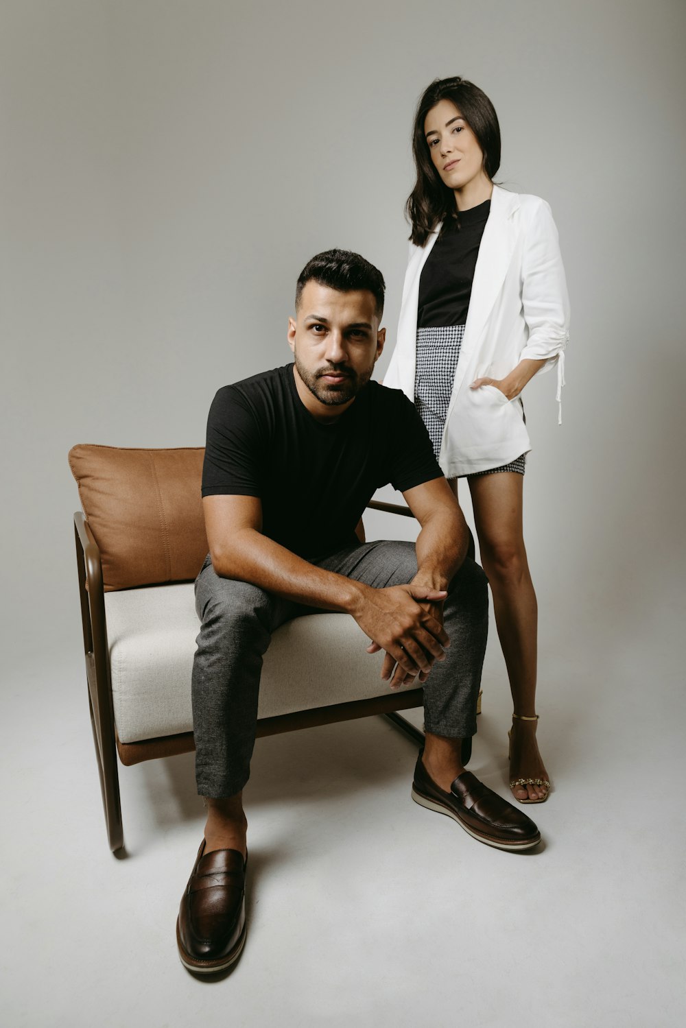 a man and a woman sitting on a chair