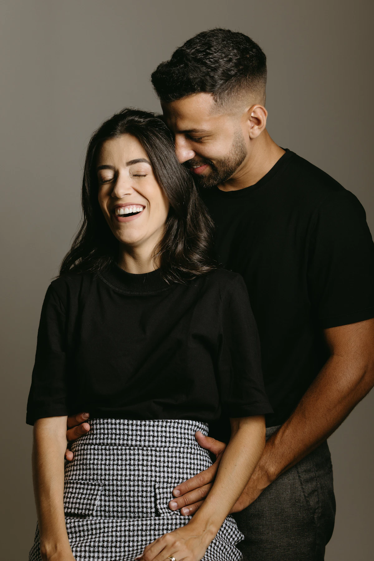Happy couple smiling together after matching on a dating app