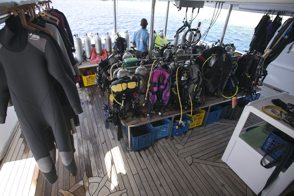 a bunch of scuba gear on a boat