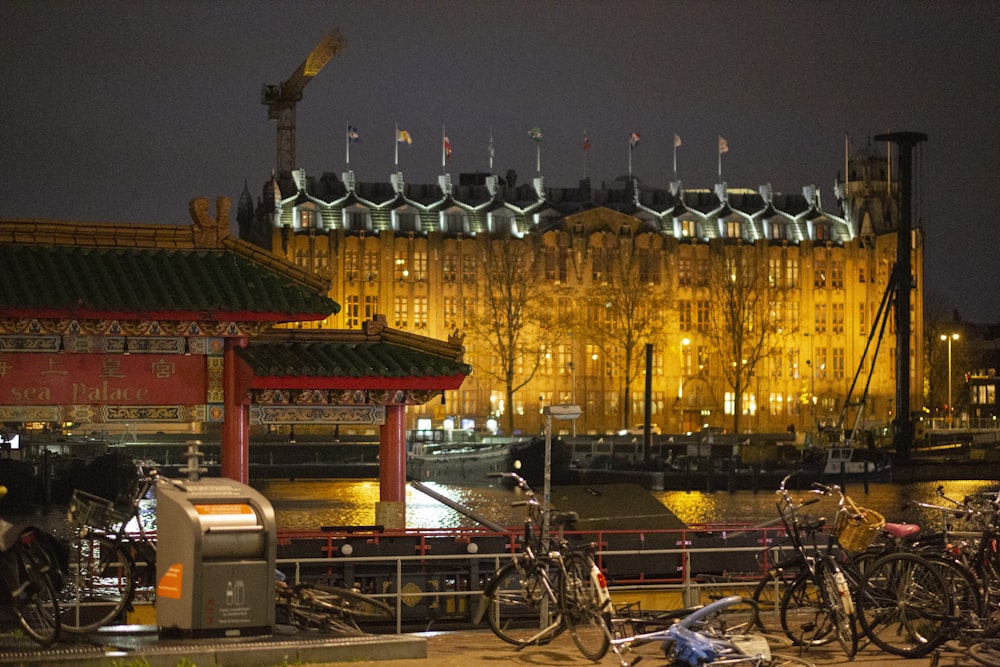 a group of bikes parked next to each other in front of a building