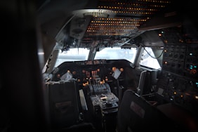 a view of the cockpit of an airplane at night