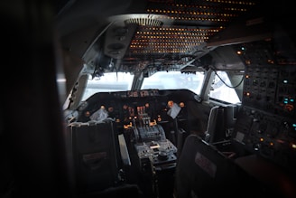 a view of the cockpit of an airplane at night