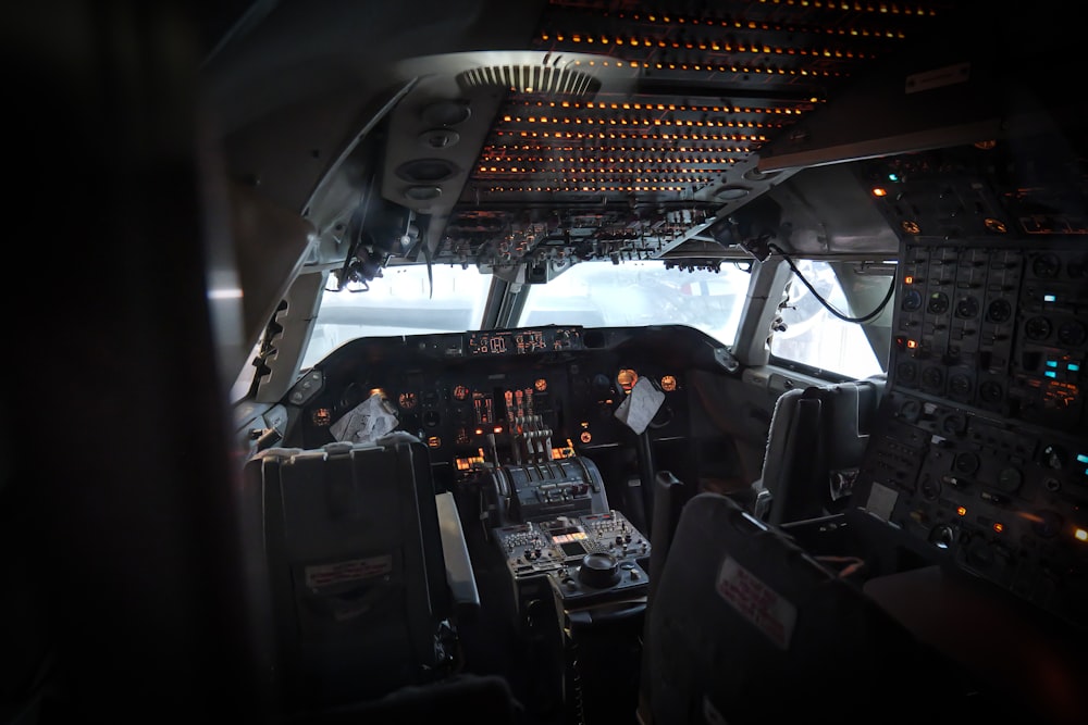 a view of the cockpit of an airplane at night