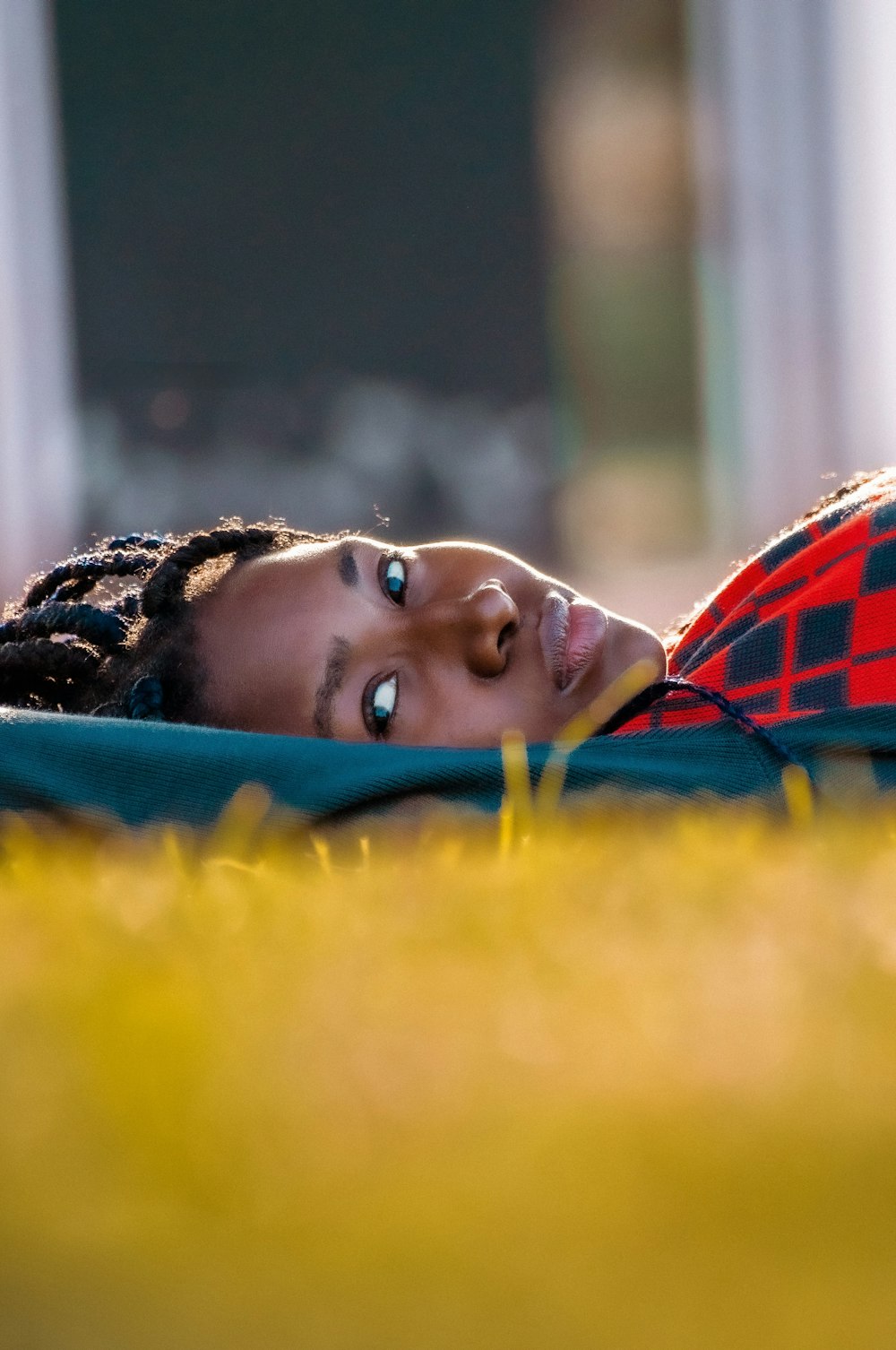 a woman laying on the ground with her eyes closed