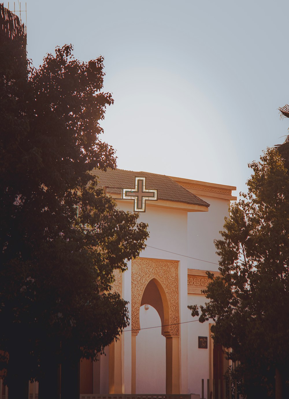 a church with a cross on the top of it