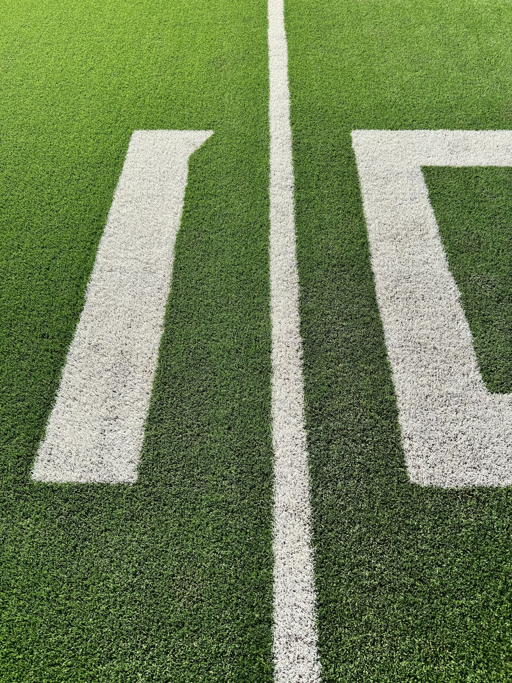 a close up of a football field with the number ten on it