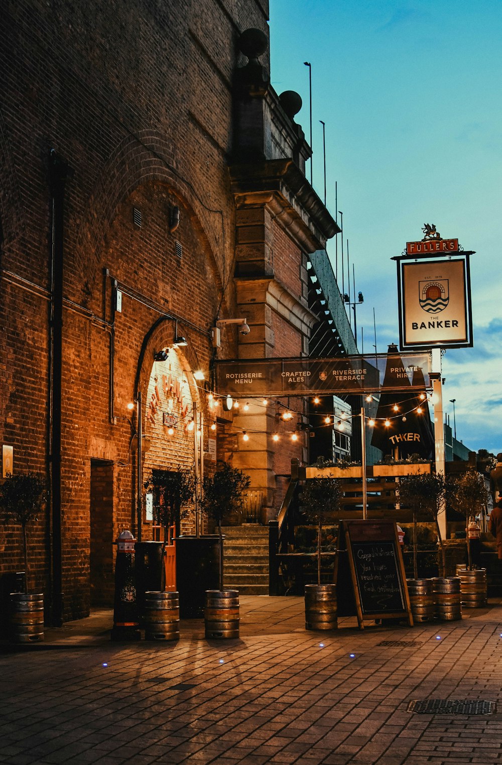 a brick building with a sign for a restaurant