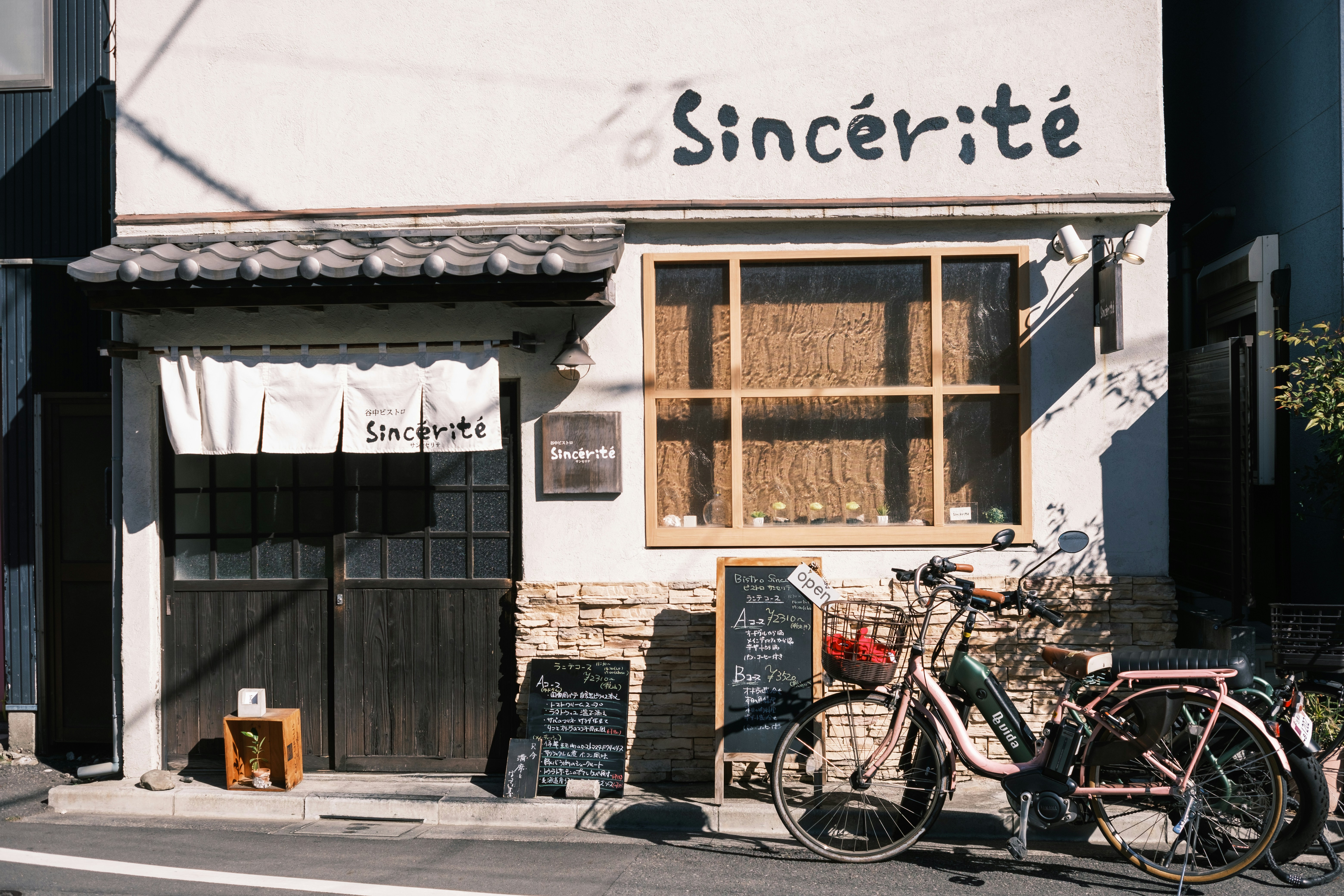 a couple of bikes parked outside of a building