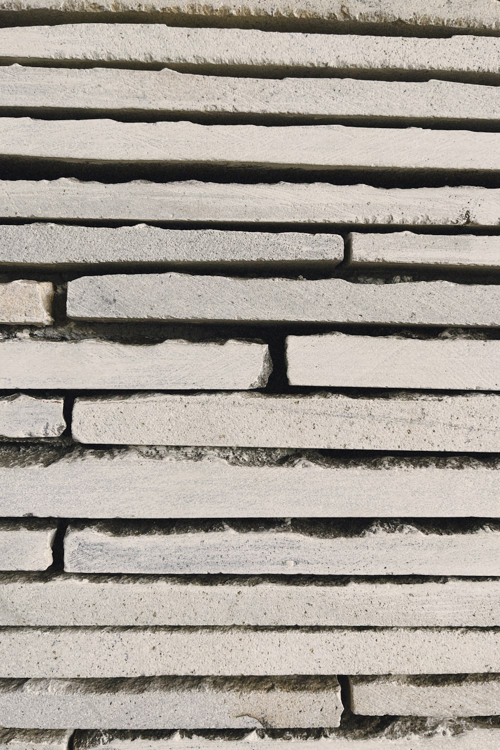 a close up of a brick wall made of cement