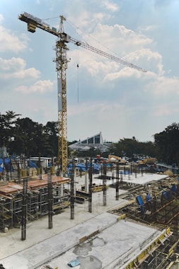 a construction site with a crane in the background