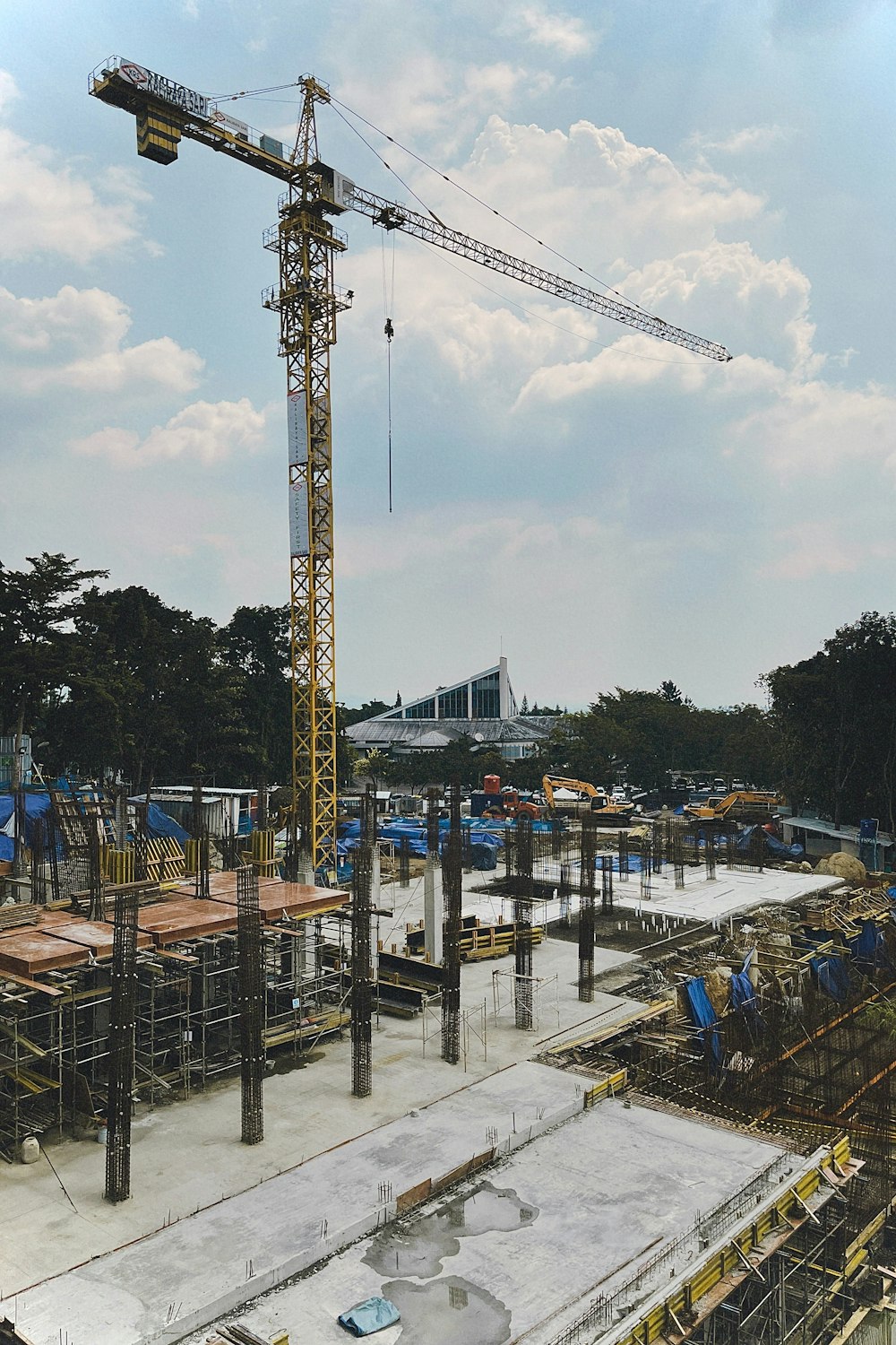 a construction site with a crane in the background