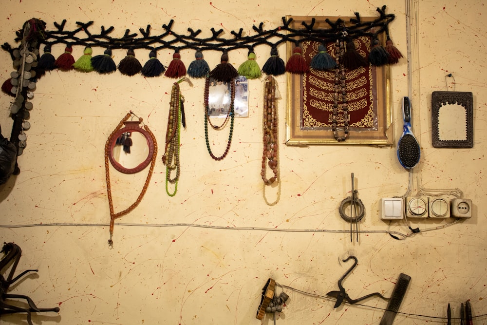 a wall with a bunch of different items hanging on it