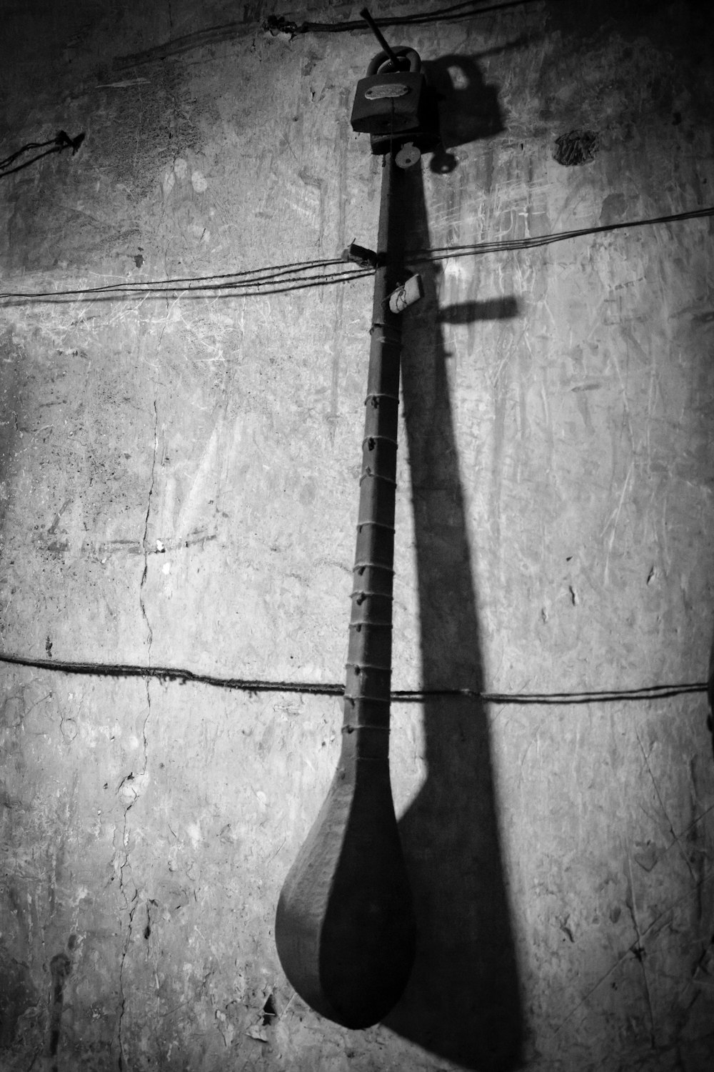 a black and white photo of a tennis racket